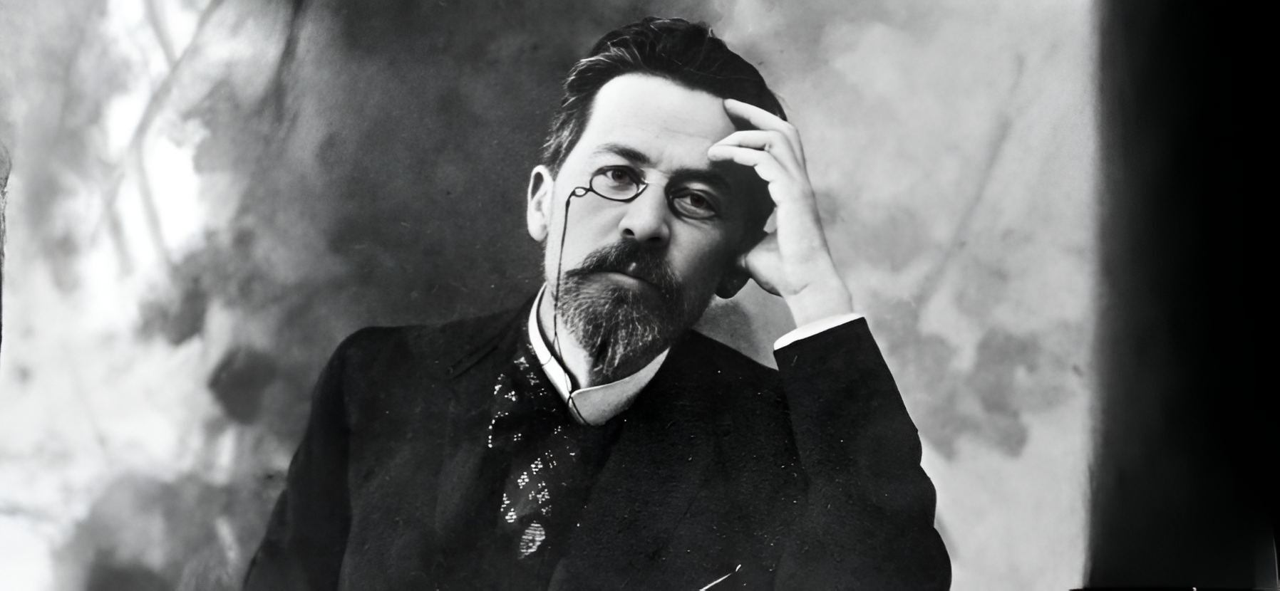 Studio portrait of Anton Chekhov resting his head on his hand